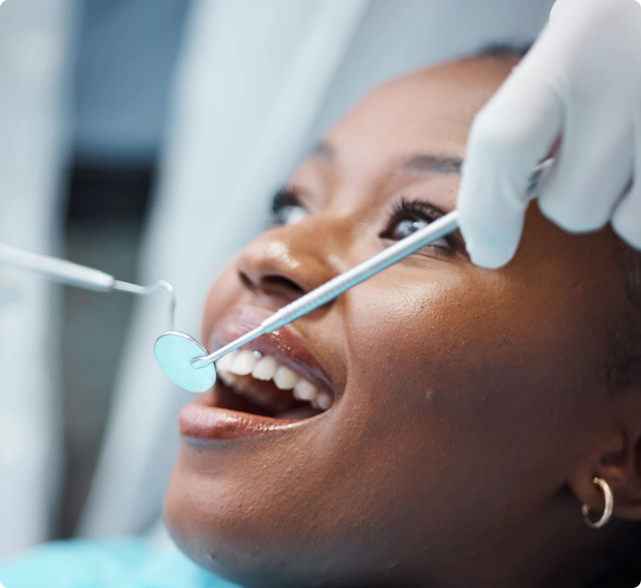 Woman doing dental treatment dentist using instruments