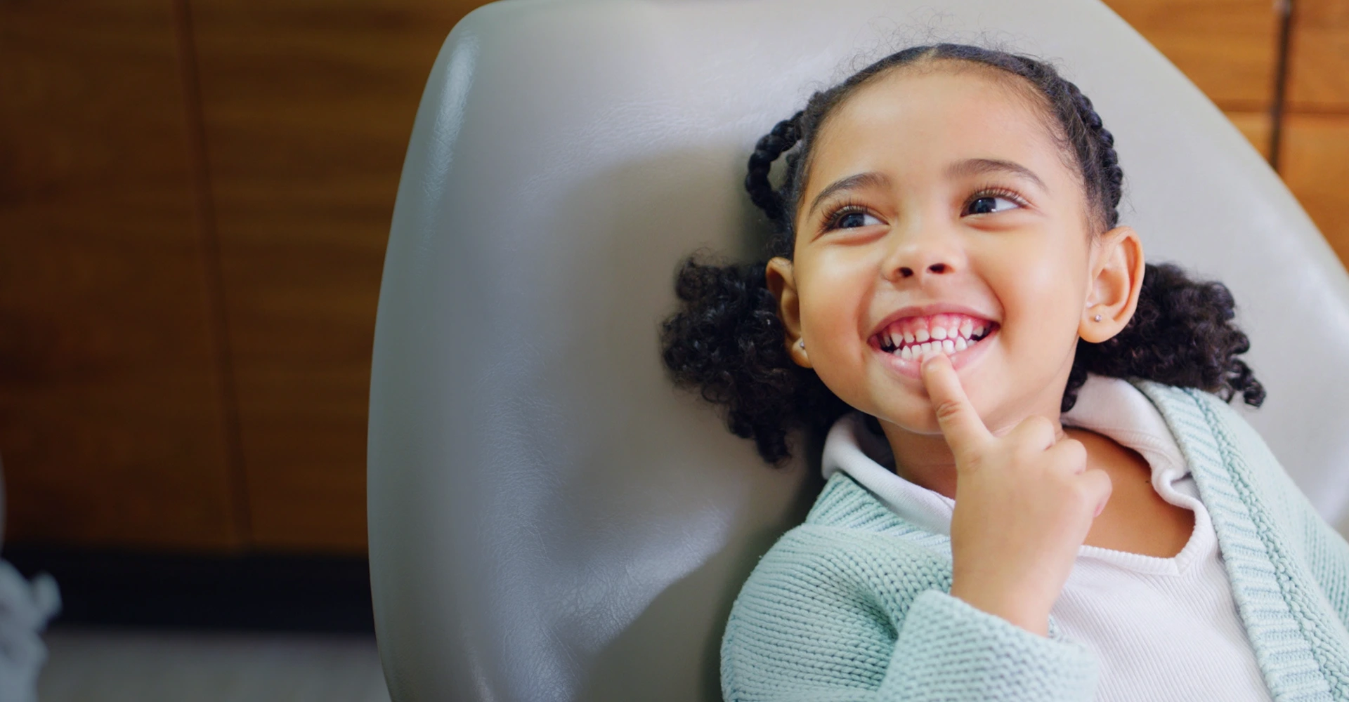 Young girl smiling showing teeth